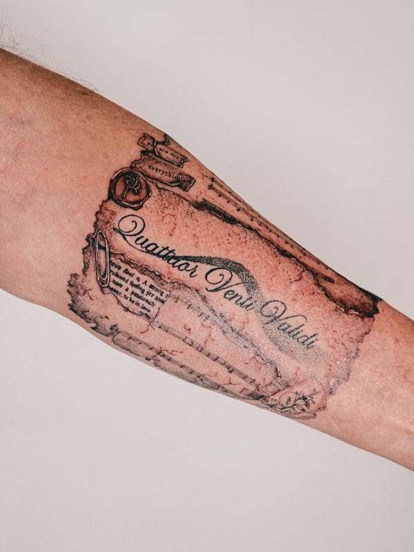 Trompe-l'oeil torn love letter tattoo with wax seal